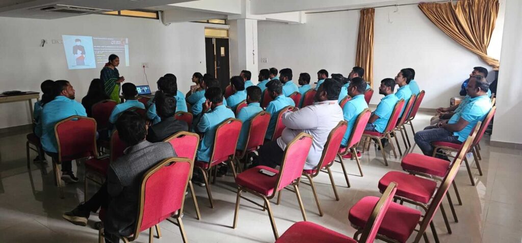 Employees attending PoSH awareness program on workplace harassment prevention.